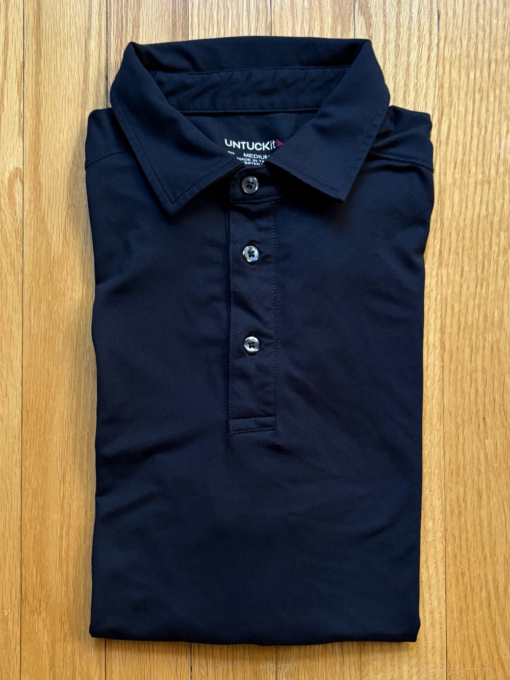 UNTUCKit Men’s Short Sleeve Performance Polo Shirt Medium Black Solid